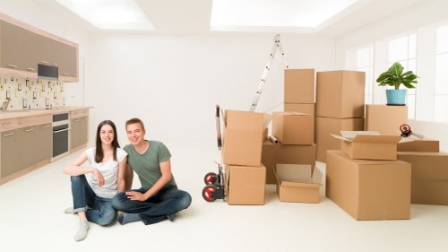 Professional moving team handling boxes and belongings in Mayfair