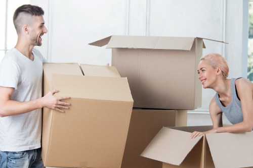 Trained moving staff handling furniture carefully during a Mayfair van move